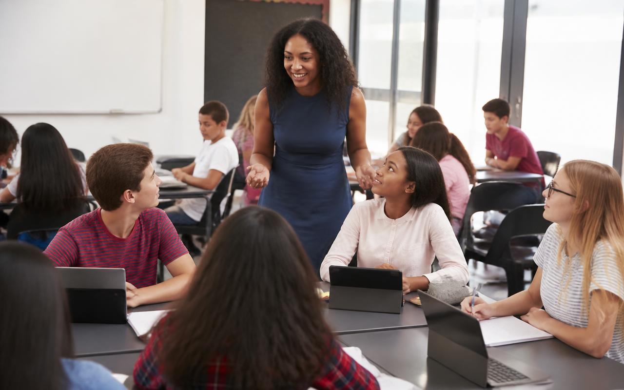 Middle school students exploring career interests with a teacher
